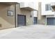 A view of multiple garages, showing parking spaces for townhomes at 1287 Quitman St, Denver, CO 80204