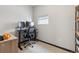 Minimalist office with modern desk setup, carpet flooring, and a window for natural lighting at 1287 Quitman St, Denver, CO 80204