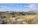 Picturesque park view showcasing open green spaces, a playground, and the cityscape in the distance at 1287 Quitman St, Denver, CO 80204