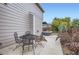 Charming patio area with a dining table and wrought iron chairs, perfect for enjoying outdoor meals at 1641 Cedarwood Dr, Longmont, CO 80504