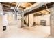 Spacious unfinished basement with exposed ceiling, providing a blank canvas for customization at 1641 Cedarwood Dr, Longmont, CO 80504