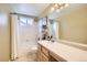 Cozy bathroom featuring an extended vanity and shower over tub at 1641 Cedarwood Dr, Longmont, CO 80504