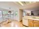 Charming breakfast nook featuring a table by the bay window, connecting to the kitchen at 1641 Cedarwood Dr, Longmont, CO 80504