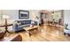 Inviting living room with wood floors, comfortable seating, and elegant dining area at 1641 Cedarwood Dr, Longmont, CO 80504