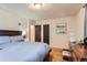 Bedroom features hardwood floors, two closets, and natural light at 1635 Winona Ct, Denver, CO 80204