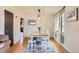 Charming dining area with a stylish light fixture, hardwood floors, and comfortable seating at 1635 Winona Ct, Denver, CO 80204