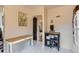 Neutral kitchen featuring white floors, white table with rope legs, and kitchen cart at 1635 Winona Ct, Denver, CO 80204