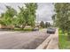 Quiet residential street featuring well-maintained homes, mature trees, and parked cars along the curb, creating a serene atmosphere at 1635 Winona Ct, Denver, CO 80204