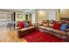 Finished basement featuring ping pong table, and two leather sofas at 7881 S Ivy Ct, Centennial, CO 80112