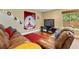 Finished basement with two leather sofas and a television at 7881 S Ivy Ct, Centennial, CO 80112