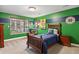 Bright bedroom featuring themed decor, a large window, and comfortable furnishings at 7881 S Ivy Ct, Centennial, CO 80112