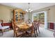 Formal dining room boasts a large hutch and access to the outdoor deck at 7881 S Ivy Ct, Centennial, CO 80112