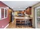 Spacious kitchen features granite counters, stainless appliances, and a breakfast bar with stools at 7881 S Ivy Ct, Centennial, CO 80112