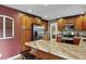 Kitchen island boasts granite counters and wood cabinets and stainless steel appliances at 7881 S Ivy Ct, Centennial, CO 80112