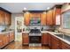 Charming kitchen with stainless steel appliances, granite countertops, and abundant cabinet space at 7881 S Ivy Ct, Centennial, CO 80112