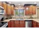 Updated kitchen features stainless steel appliances and granite countertops at 7881 S Ivy Ct, Centennial, CO 80112