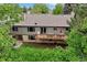 Expansive rear view of home featuring a deck, neutral siding, and well-maintained landscaping at 7881 S Ivy Ct, Centennial, CO 80112