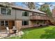 Back of house featuring a patio area, grassy yard, and inviting deck at 7881 S Ivy Ct, Centennial, CO 80112