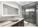 Modern bathroom with designer sink, lighted mirror, and glass shower at 8523 S Flower Ct, Littleton, CO 80128