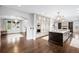 Open-concept kitchen with a center island, custom cabinetry, and high-end stainless steel appliances at 8523 S Flower Ct, Littleton, CO 80128