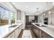 Well-appointed kitchen with granite countertops, custom cabinets, and high-end stainless steel appliances at 8523 S Flower Ct, Littleton, CO 80128