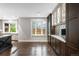 Gourmet kitchen featuring a center island, stainless appliances, and a cozy window seat at 8523 S Flower Ct, Littleton, CO 80128