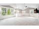 Bright, neutral main bedroom with large windows and plenty of natural light and custom lighting at 8523 S Flower Ct, Littleton, CO 80128