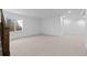 Unfinished basement area with neutral carpet, window and stairwell, ready to customize to your specific needs and design preferences at 5625 W 141St Ln, Broomfield, CO 80020