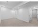 Finished basement offers neutral carpet, white walls, and multiple doorways, perfect for creating customized living spaces at 5625 W 141St Ln, Broomfield, CO 80020