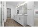 Elegant bathroom features a double vanity with modern fixtures and a glass-enclosed shower at 5625 W 141St Ln, Broomfield, CO 80020