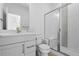 Modern bathroom with glass shower, white vanity, and sleek fixtures offers comfort at 5625 W 141St Ln, Broomfield, CO 80020
