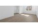 Unfurnished bedroom features luxury vinyl plank flooring, a bright window and a walk-in closet at 5625 W 141St Ln, Broomfield, CO 80020