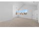 Bright bedroom with large window offering neighborhood views, neutral paint, and carpet flooring at 5625 W 141St Ln, Broomfield, CO 80020
