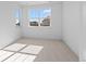 Bright bedroom features large windows and neutral carpeting providing a calm, airy feel at 5625 W 141St Ln, Broomfield, CO 80020
