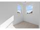 A cozy bedroom is illuminated by two windows, creating a bright and inviting space at 5625 W 141St Ln, Broomfield, CO 80020