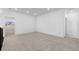 A spacious, carpeted bonus room features recessed lighting, neutral paint, and an open doorway at 5625 W 141St Ln, Broomfield, CO 80020