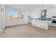 Open kitchen with a center island, pendant lighting, and modern appliances at 5625 W 141St Ln, Broomfield, CO 80020