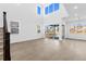 Spacious living room features high ceilings, large windows, and luxury vinyl plank flooring at 5625 W 141St Ln, Broomfield, CO 80020