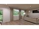 Comfortable living room featuring a neutral color palette and large windows at 3948 N Riviera Ct, Aurora, CO 80019