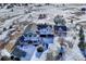 Aerial view of house, barn and surrounding snowy landscape at 33100 Ridgeview Loop, Elizabeth, CO 80107