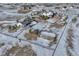 Aerial view of house, barn and expansive snowy property at 33100 Ridgeview Loop, Elizabeth, CO 80107