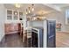 Basement bar area with wine cooler and seating at 33100 Ridgeview Loop, Elizabeth, CO 80107