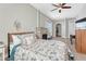 Main bedroom with fireplace, ceiling fan, and walk-in closet at 33100 Ridgeview Loop, Elizabeth, CO 80107