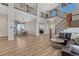 Bright and airy entryway with hardwood floors and a staircase at 33100 Ridgeview Loop, Elizabeth, CO 80107