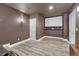 Finished basement home theater room with projector screen and recessed lighting at 33100 Ridgeview Loop, Elizabeth, CO 80107