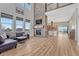 Spacious living room featuring a stone fireplace and hardwood floors at 33100 Ridgeview Loop, Elizabeth, CO 80107