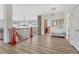 Upstairs hallway with laundry area and hardwood floors at 33100 Ridgeview Loop, Elizabeth, CO 80107