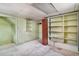 Unfinished basement with some shelving at 4730 Pierce St, Wheat Ridge, CO 80033