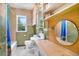 Bathroom with vintage tile and fixtures, and window at 4730 Pierce St, Wheat Ridge, CO 80033