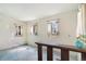Bedroom with two windows and no flooring in a home that needs updating at 4730 Pierce St, Wheat Ridge, CO 80033
